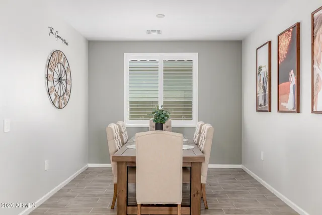 a view of a dining room with furniture window and outside view