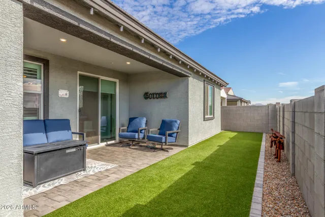 a backyard of a house with seating space