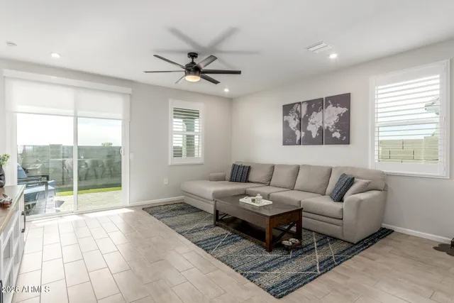 a living room with furniture and a window