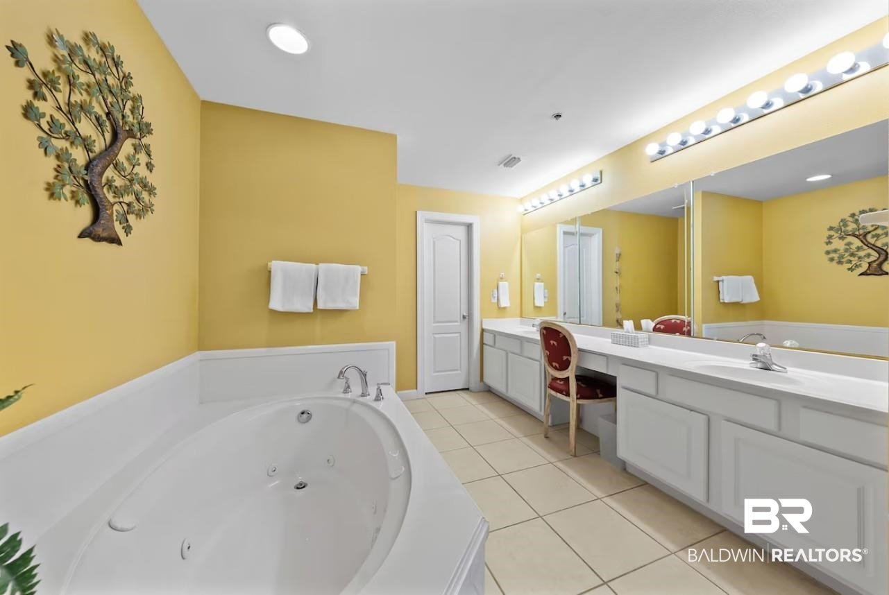 27770 Canal Road, Unit 2502 Orange Beach, AL 36561 - Photo 18 of 55 Bathroom featuring double vanity, light tile patterned floors, a whirlpool tub, and recessed lighting