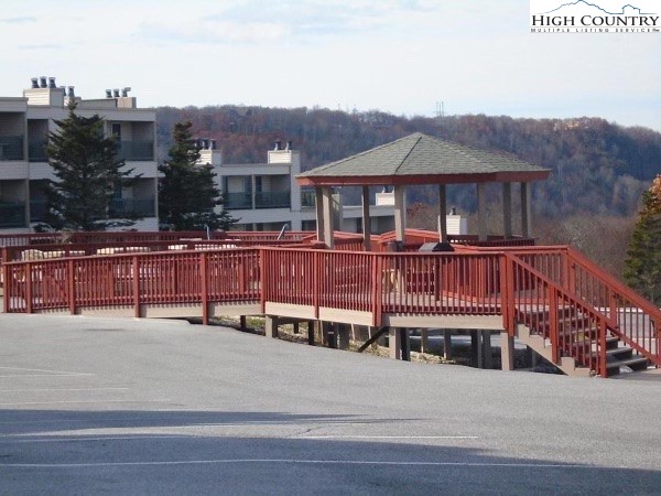 301 Pinnacle Inn Road, Unit 1105 Beech Mountain, NC 28604 - Photo 34 of 40 a view of a big house with wooden floor and city view