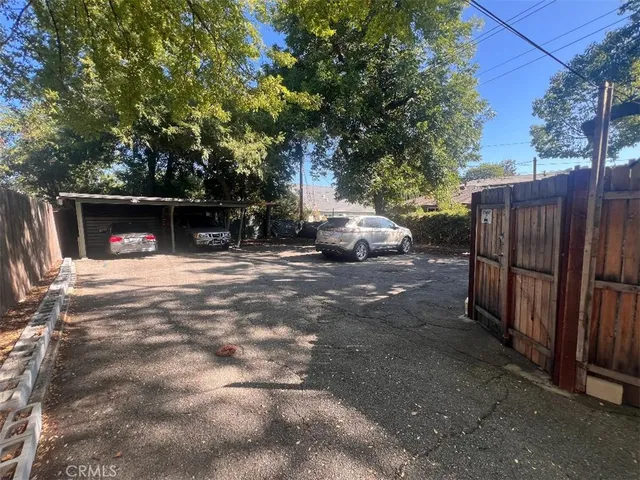 a view of street with parked cars