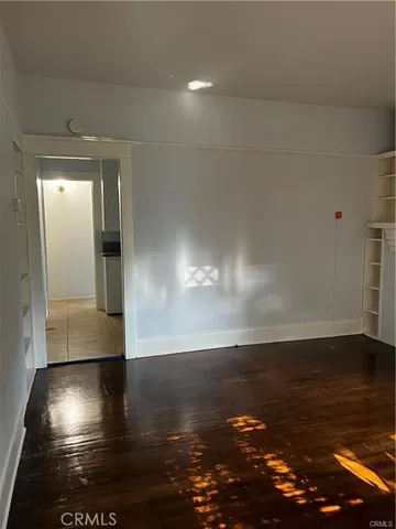a view of a livingroom with wooden floor
