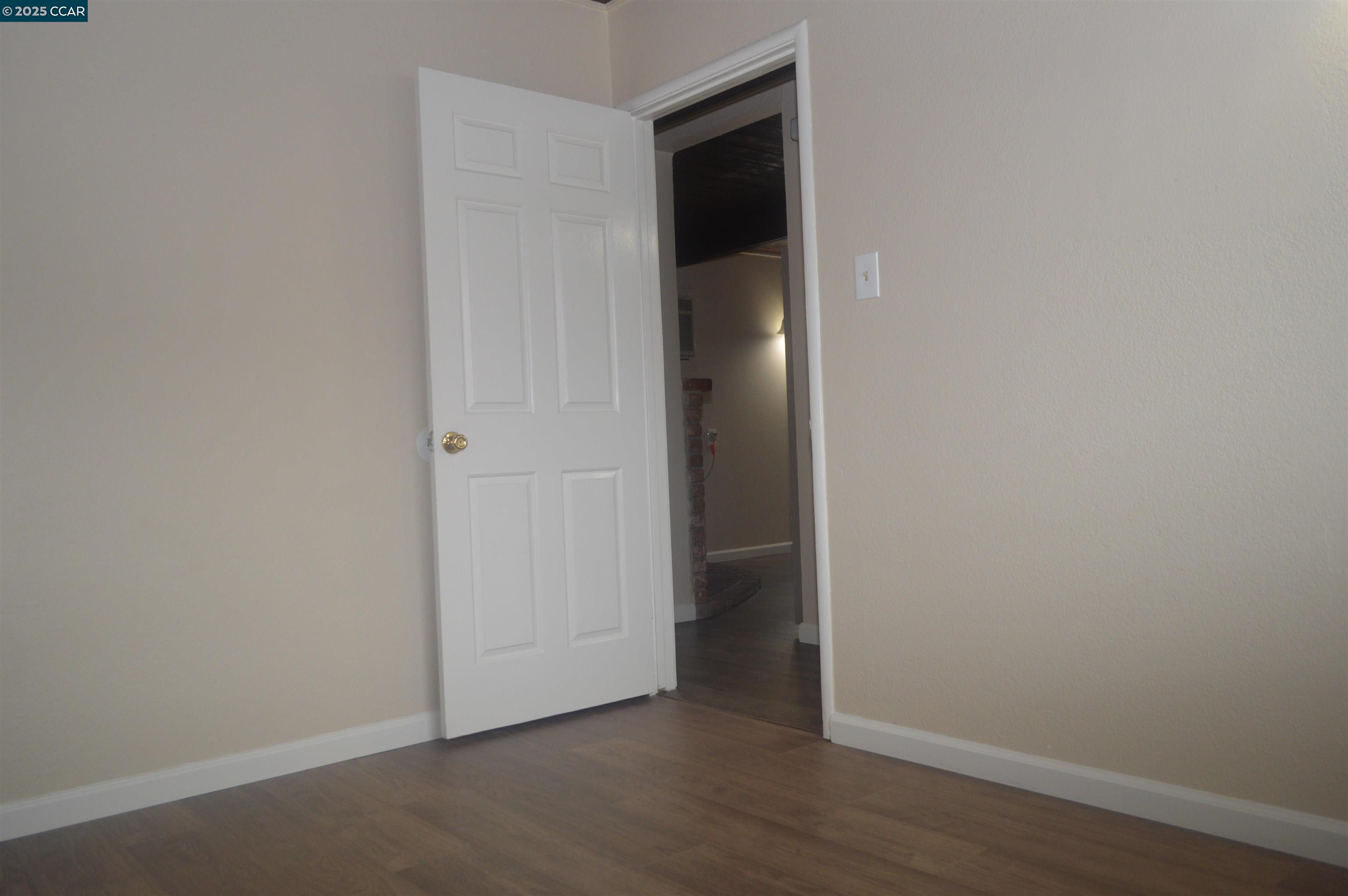 92 Beach Drive Bay Point, CA 94565 - Photo 13 of 19 an empty room with wooden floor and closet