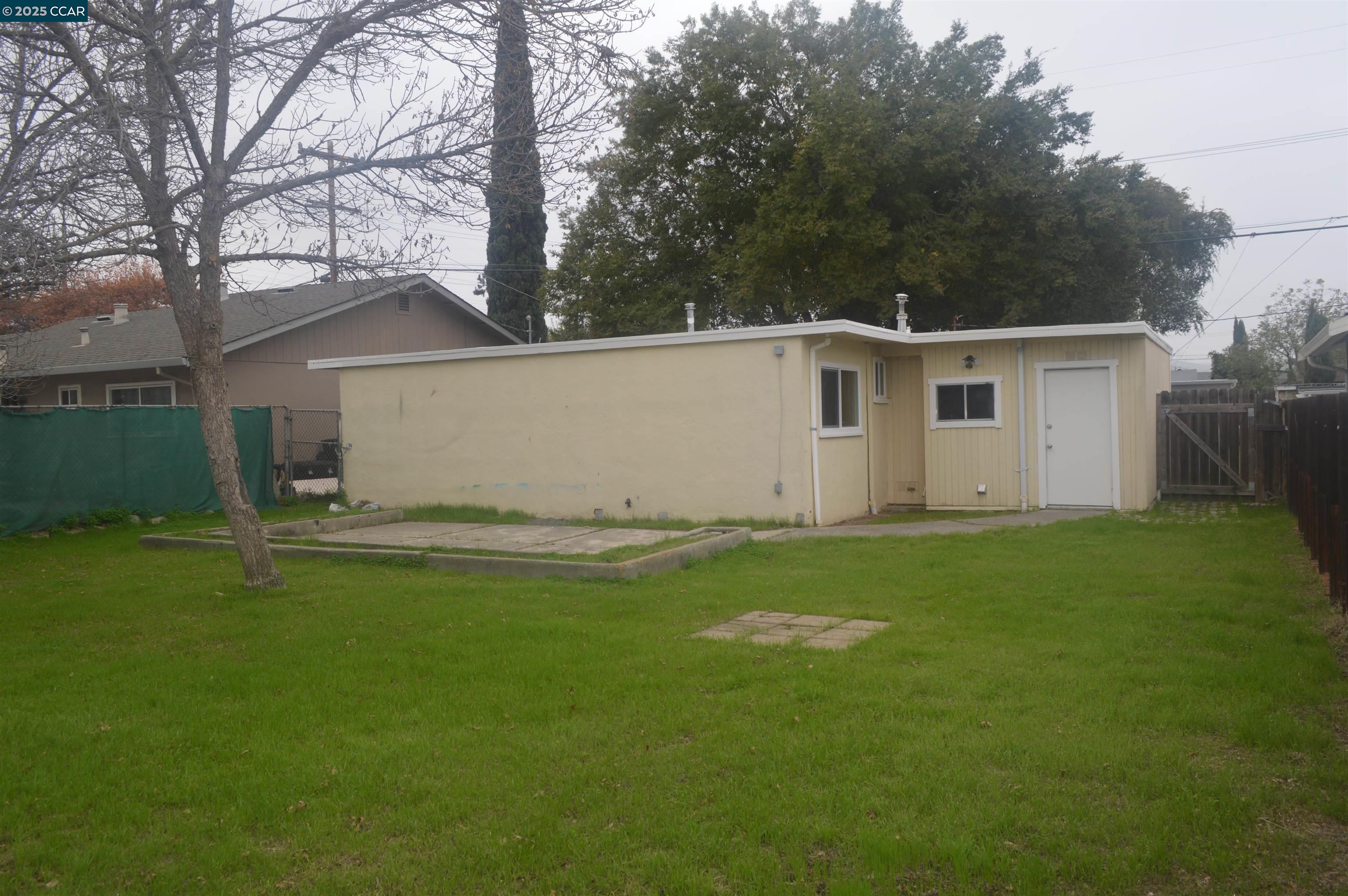 92 Beach Drive Bay Point, CA 94565 - Photo 17 of 19 a view of backyard of house with green space