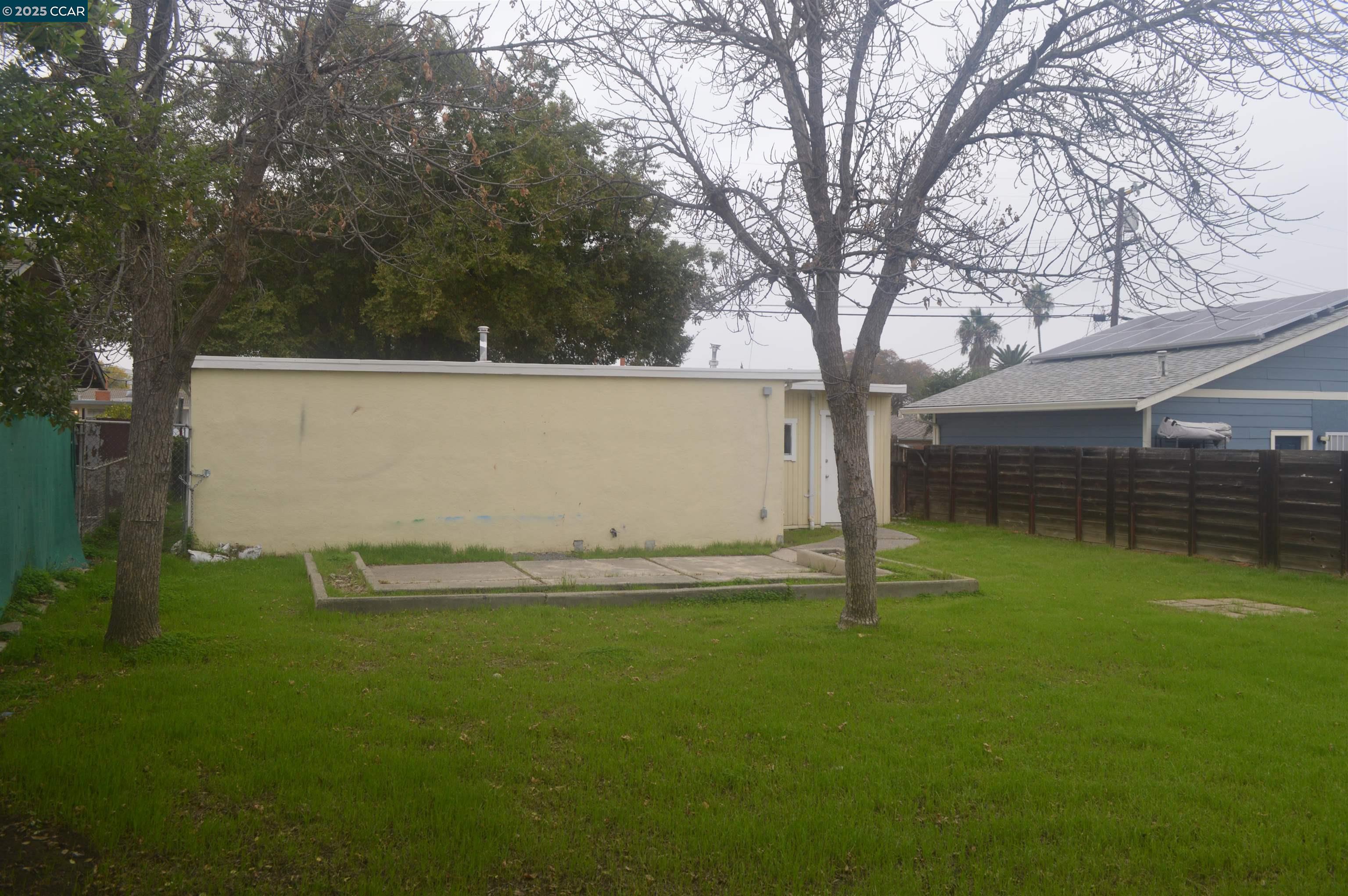 92 Beach Drive Bay Point, CA 94565 - Photo 19 of 19 a backyard of a house with lots of green space