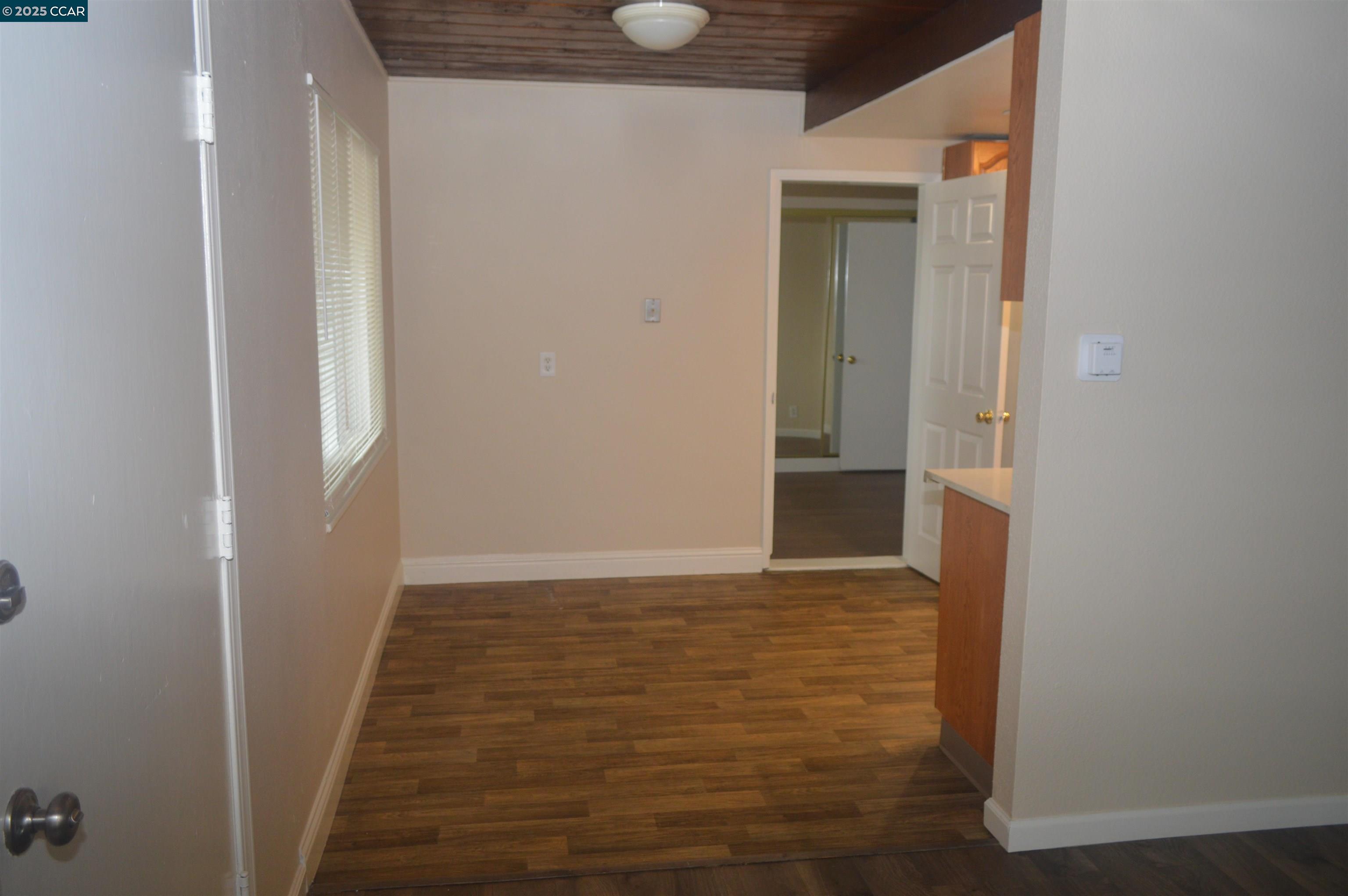 92 Beach Drive Bay Point, CA 94565 - Photo 7 of 19 a view of hallway with wooden floor