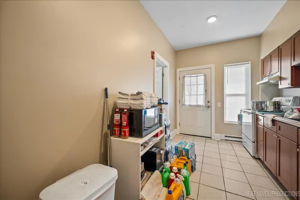 a very nice looking room with a big room with wooden floor