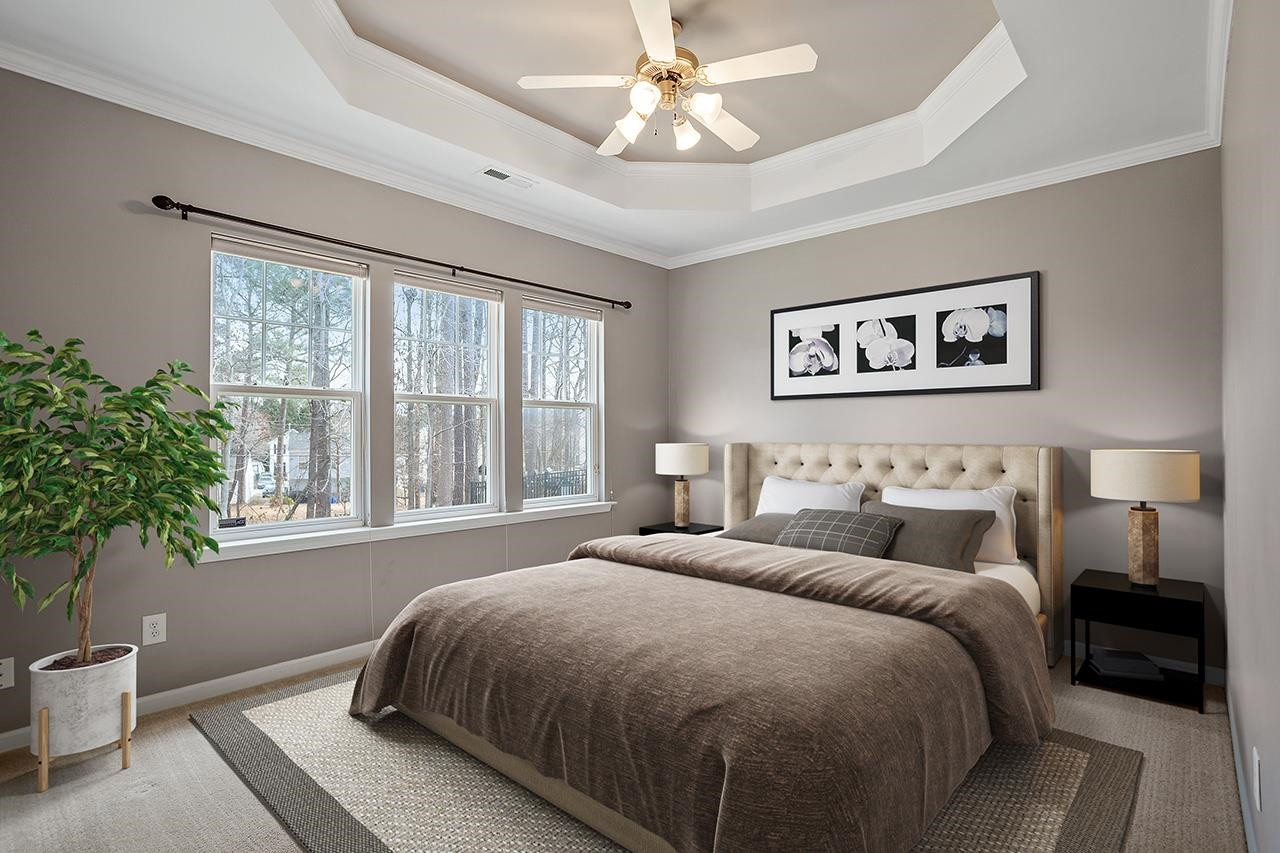 3317 Silver Star Drive Durham, NC 27713 - Photo 13 of 25 a bedroom with a large bed and a window