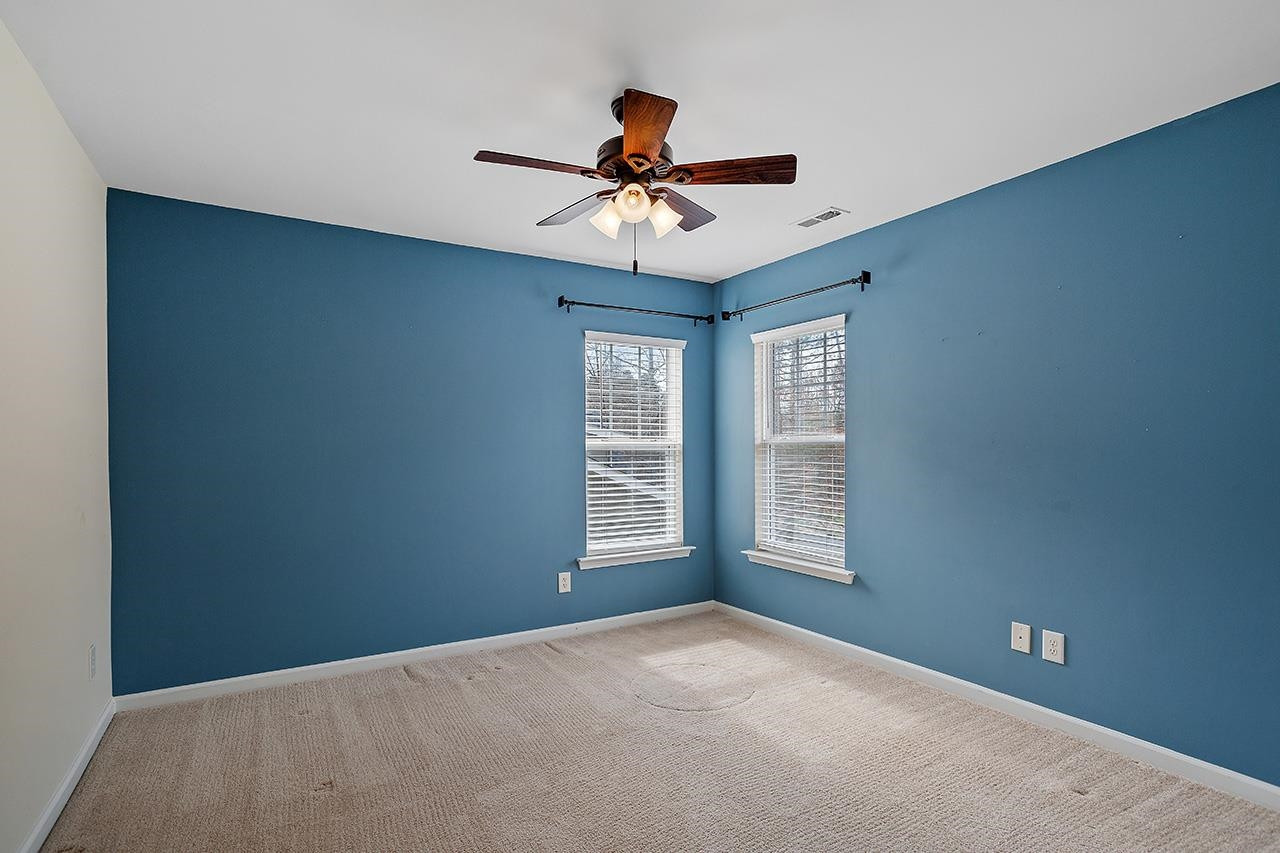3317 Silver Star Drive Durham, NC 27713 - Photo 18 of 25 a view of an empty room with a window