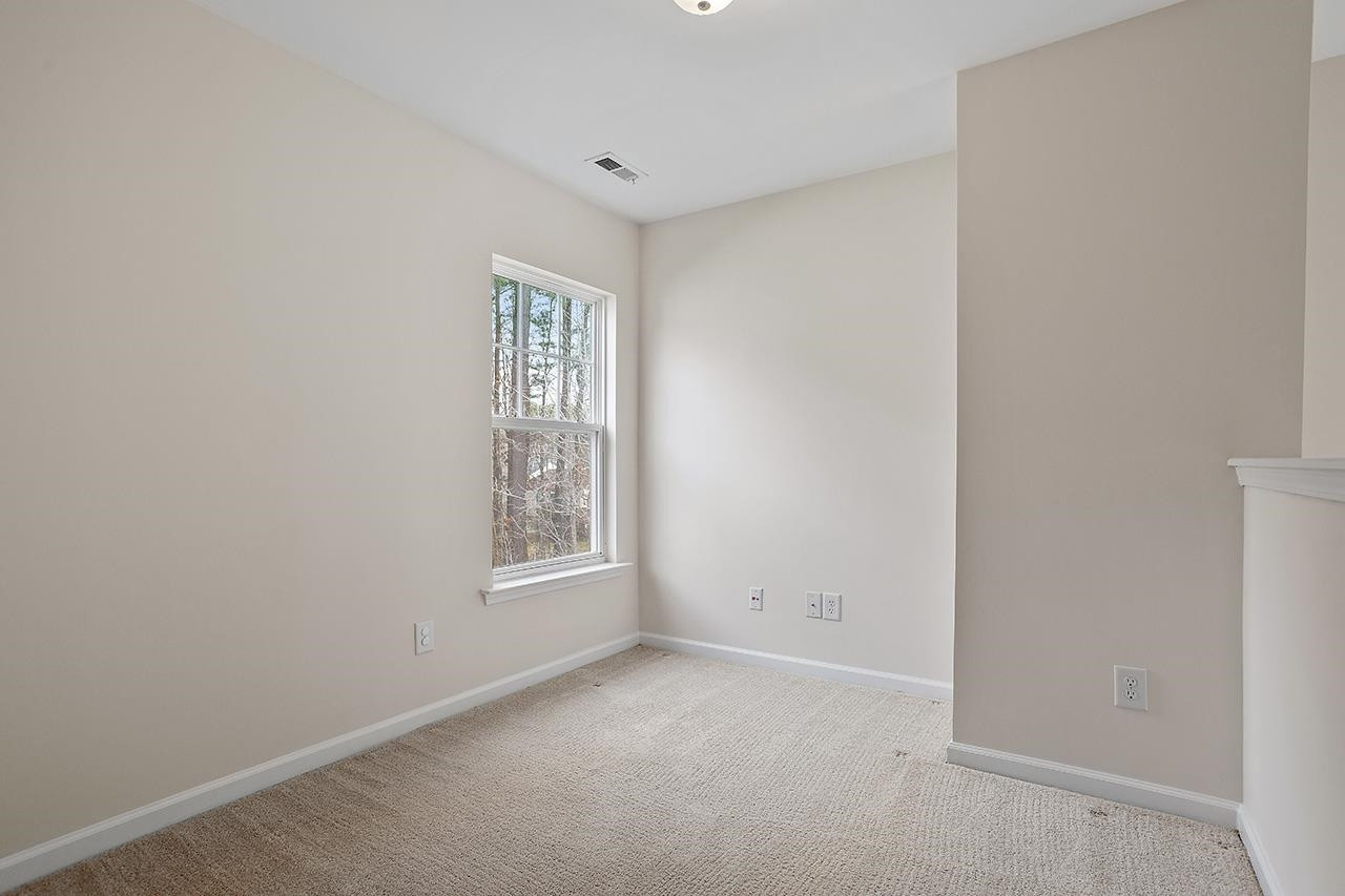 3317 Silver Star Drive Durham, NC 27713 - Photo 21 of 25 an empty room with windows