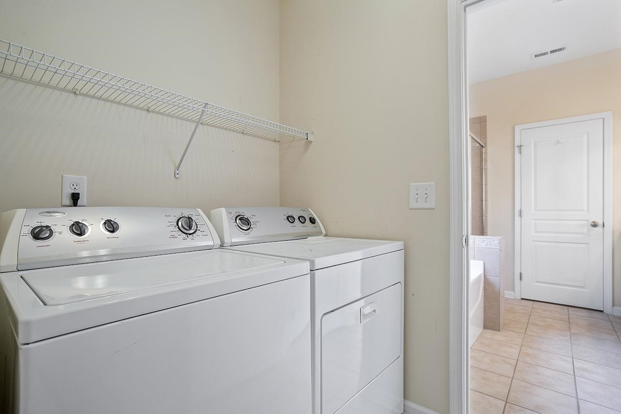 3317 Silver Star Drive Durham, NC 27713 - Photo 23 of 25 a utility room with dryer and washer