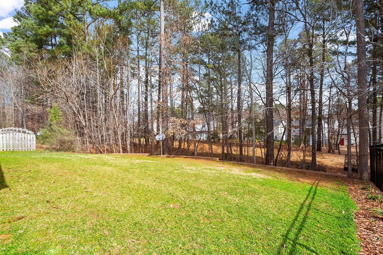 3317 Silver Star Drive Durham, NC 27713 - Photo 24 of 25 a swimming pool with trees in the background
