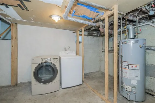 a view of a kitchen with a sink dishwasher a refrigerator and cabinets