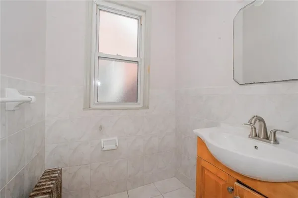 a bathroom with a sink and mirror