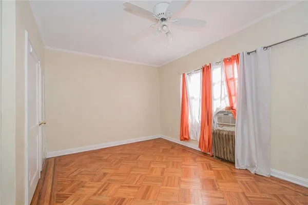 a view of a room with wooden floor and natural light