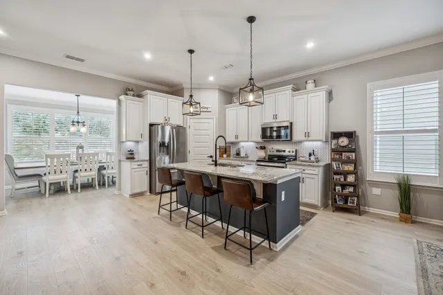 a view of a dining room with furniture window and outside view