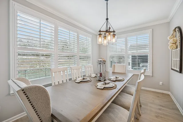 a en suite bathroom with a double vanity sink a large mirror and a shower