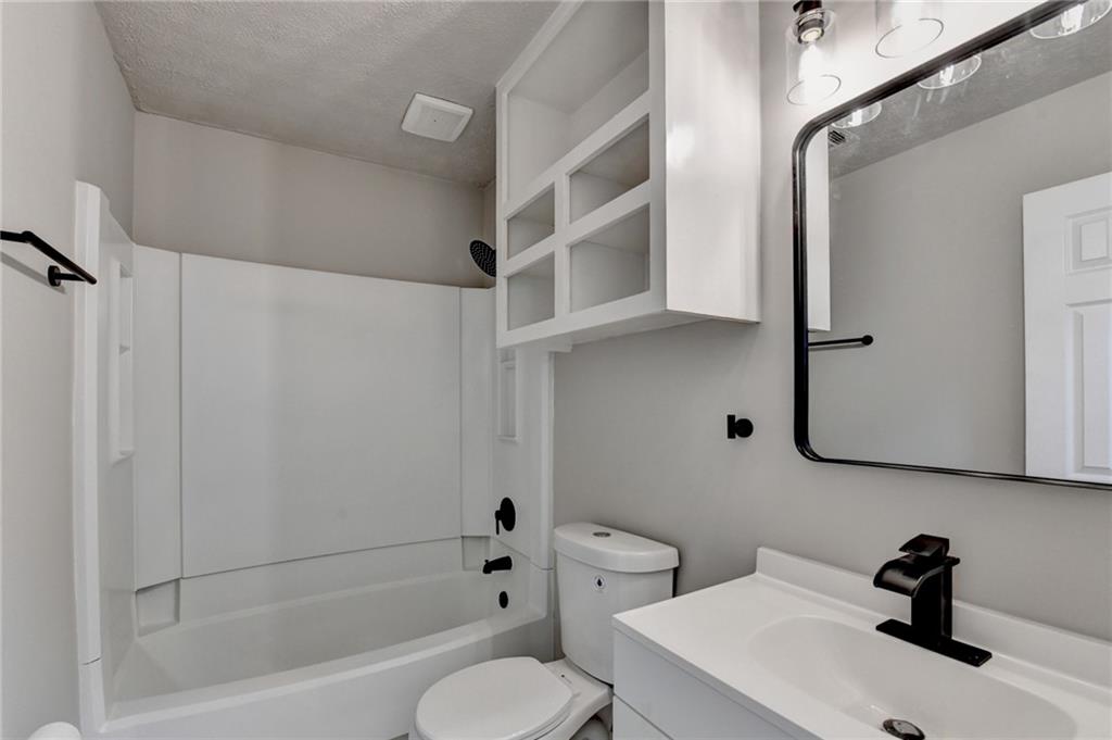 2853 Franklin Road Southwest Lawrenceville, GA 30044 - Photo 22 of 40 a bathroom with a sink toilet and shower