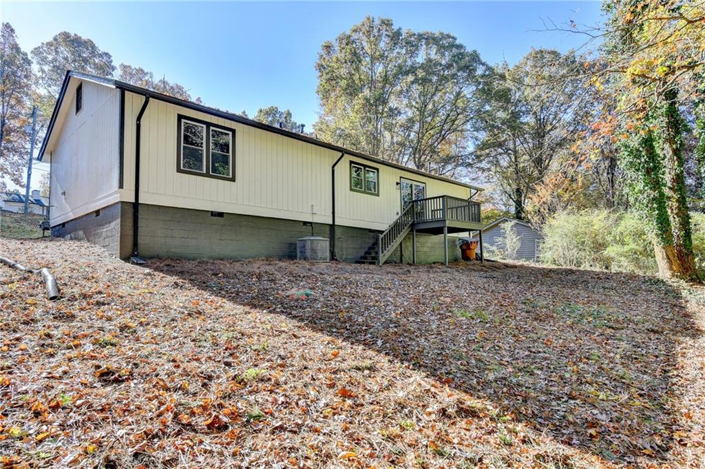 2853 Franklin Road Southwest Lawrenceville, GA 30044 - Photo 39 of 40 a view of a house with a yard and a large tree