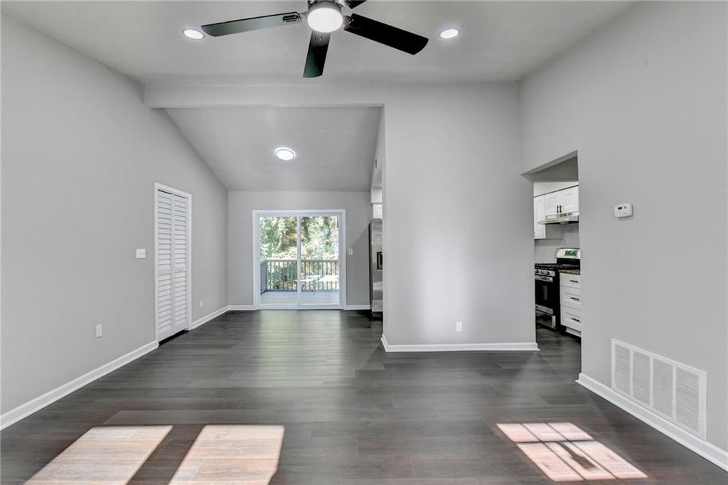 2853 Franklin Road Southwest Lawrenceville, GA 30044 - Photo 10 of 40 wooden floor in an empty room with a window