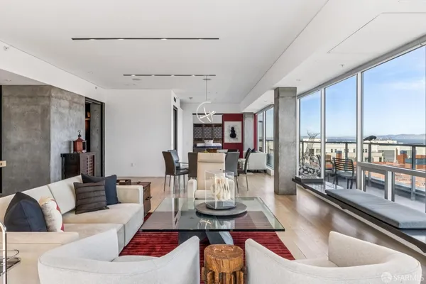a living room with large windows