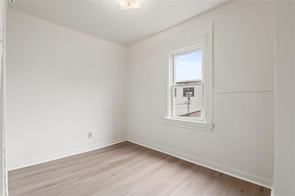 405 Main Street Coraopolis, PA 15108 - Photo 13 of 24 an empty room with wooden floor and windows