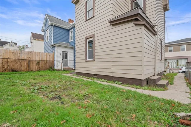 an aerial view of a house with table and chairs