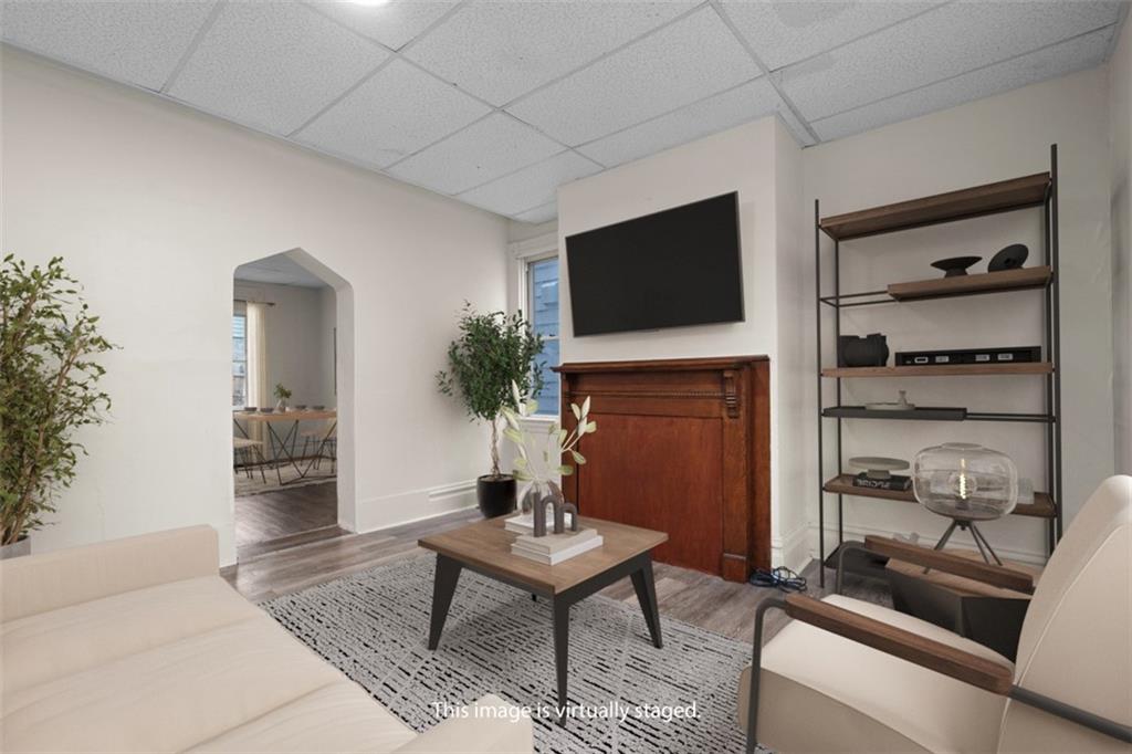 405 Main Street Coraopolis, PA 15108 - Photo 2 of 24 a living room with furniture and a flat screen tv