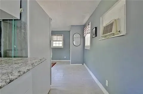 a kitchen with a sink cabinets and utility