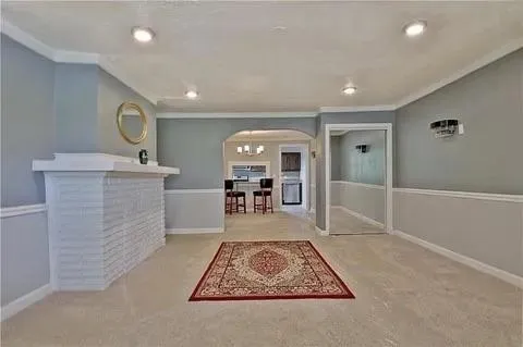 en empty room with windows and ceiling fan