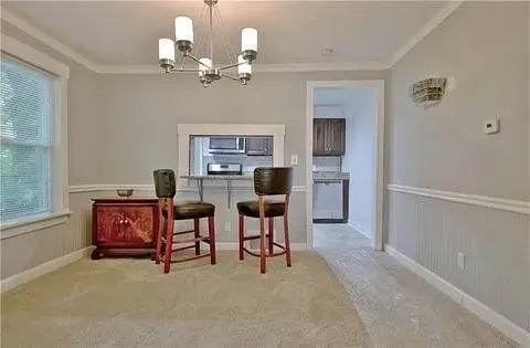 a kitchen with stainless steel appliances granite countertop a sink stove and microwave