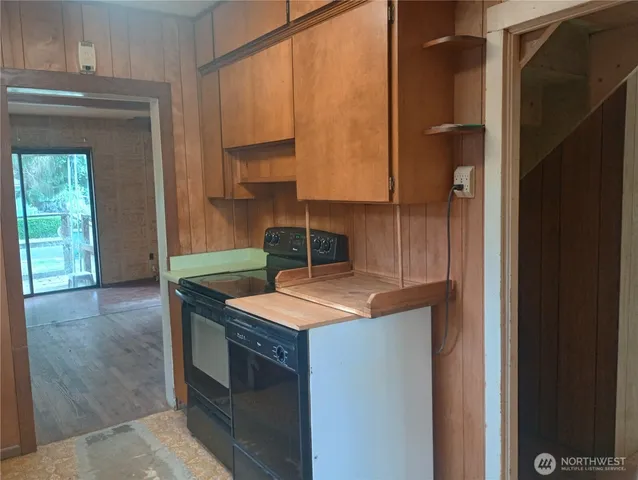 a kitchen that has a sink and a stove in it