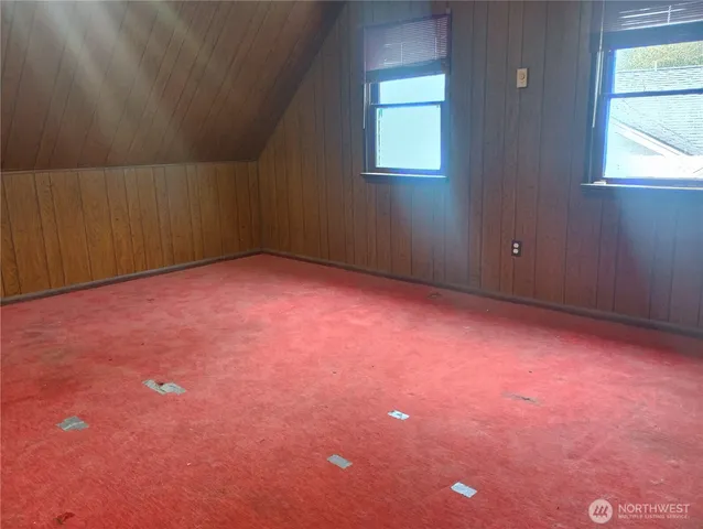 a bathroom with a shower and a door
