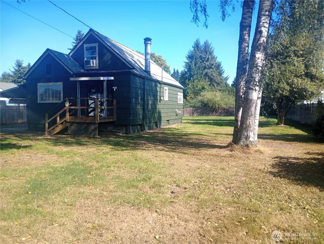 a front view of a house with a yard balcony