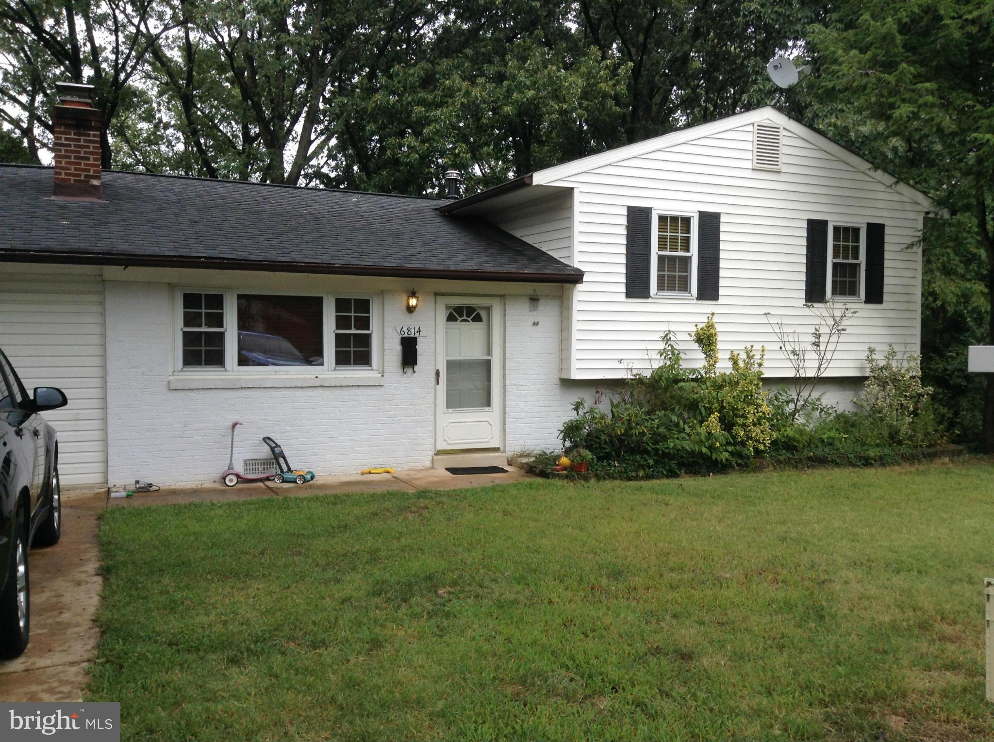 6814 Mayo Court Springfield, VA 22150 - Photo 12 of 30 a front view of a house with a yard