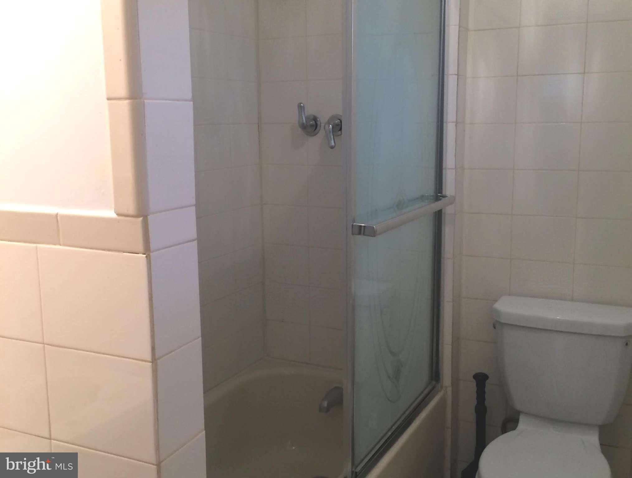 6814 Mayo Court Springfield, VA 22150 - Photo 23 of 30 a white toilet sitting next to a shower