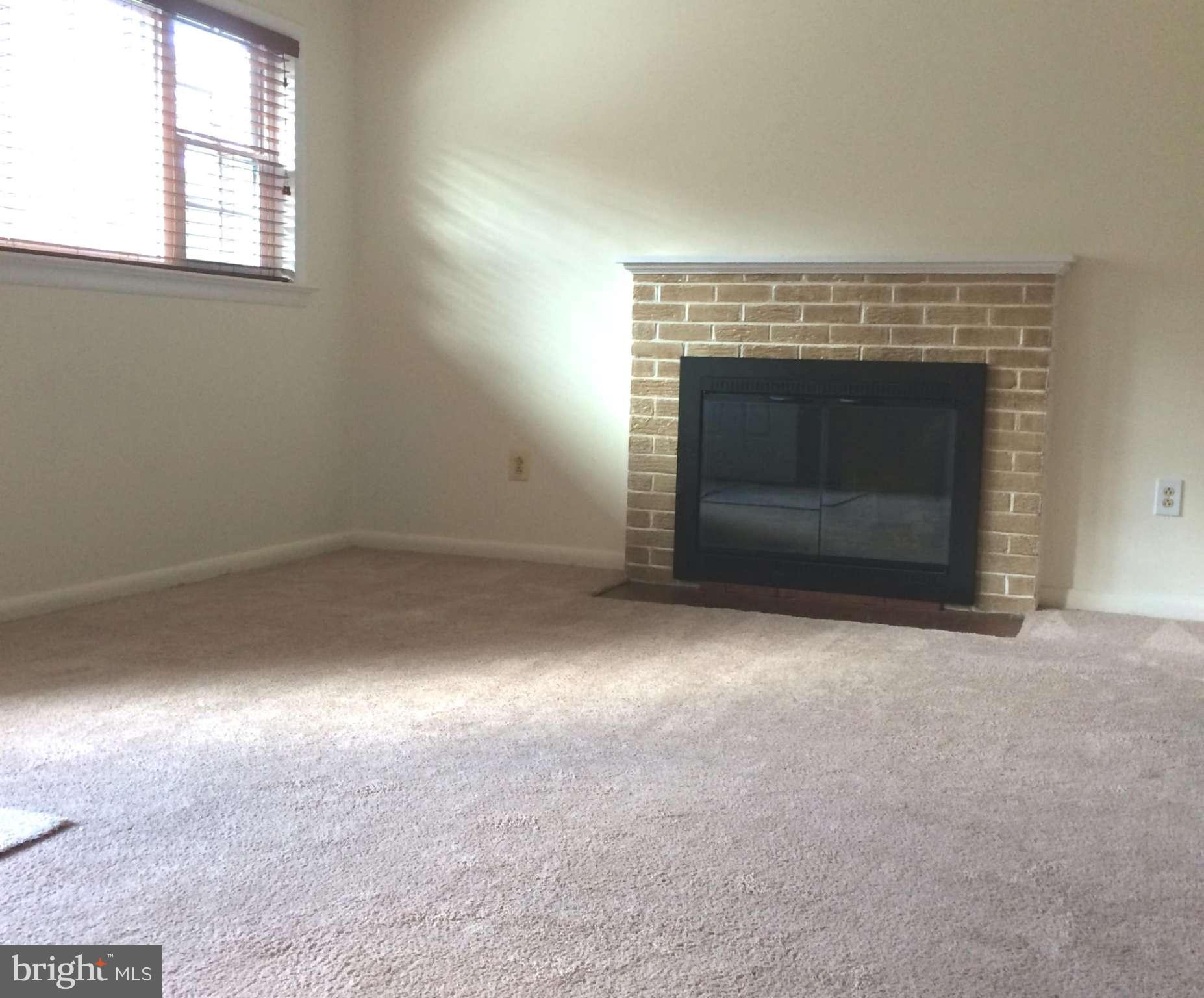 6814 Mayo Court Springfield, VA 22150 - Photo 24 of 30 an empty room with a fireplace