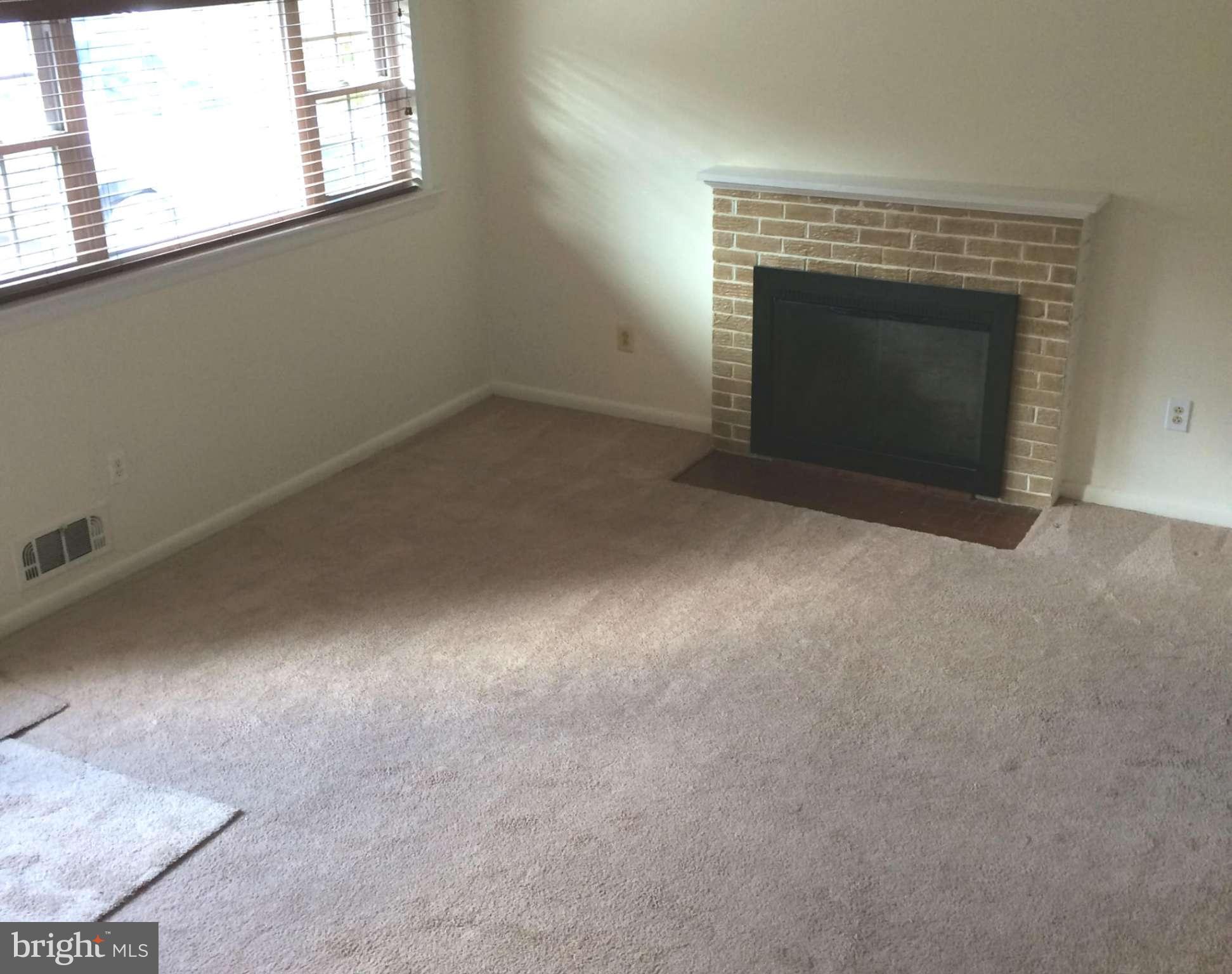 6814 Mayo Court Springfield, VA 22150 - Photo 25 of 30 an empty room with a fireplace