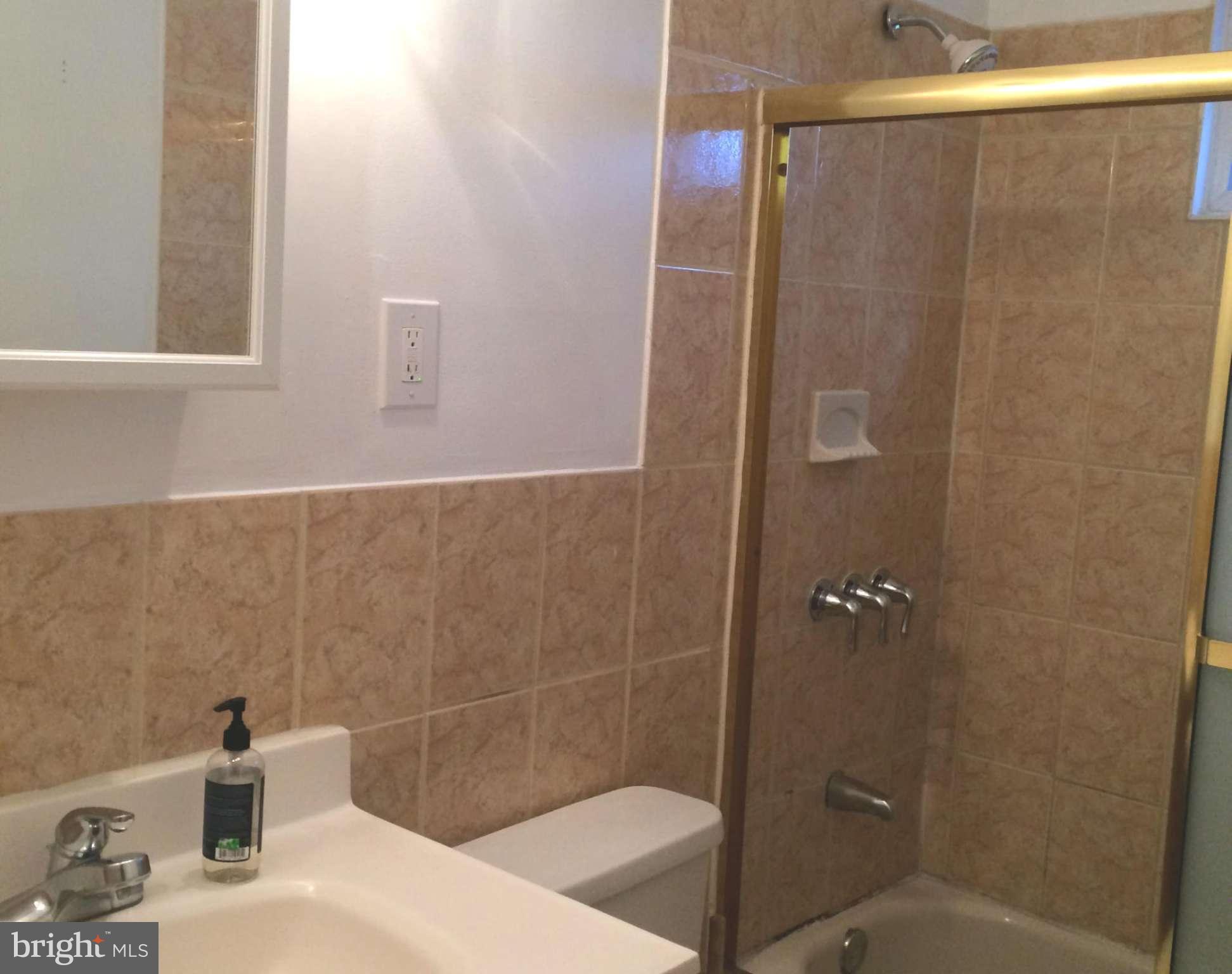 6814 Mayo Court Springfield, VA 22150 - Photo 26 of 30 a bathroom with a sink and a shower