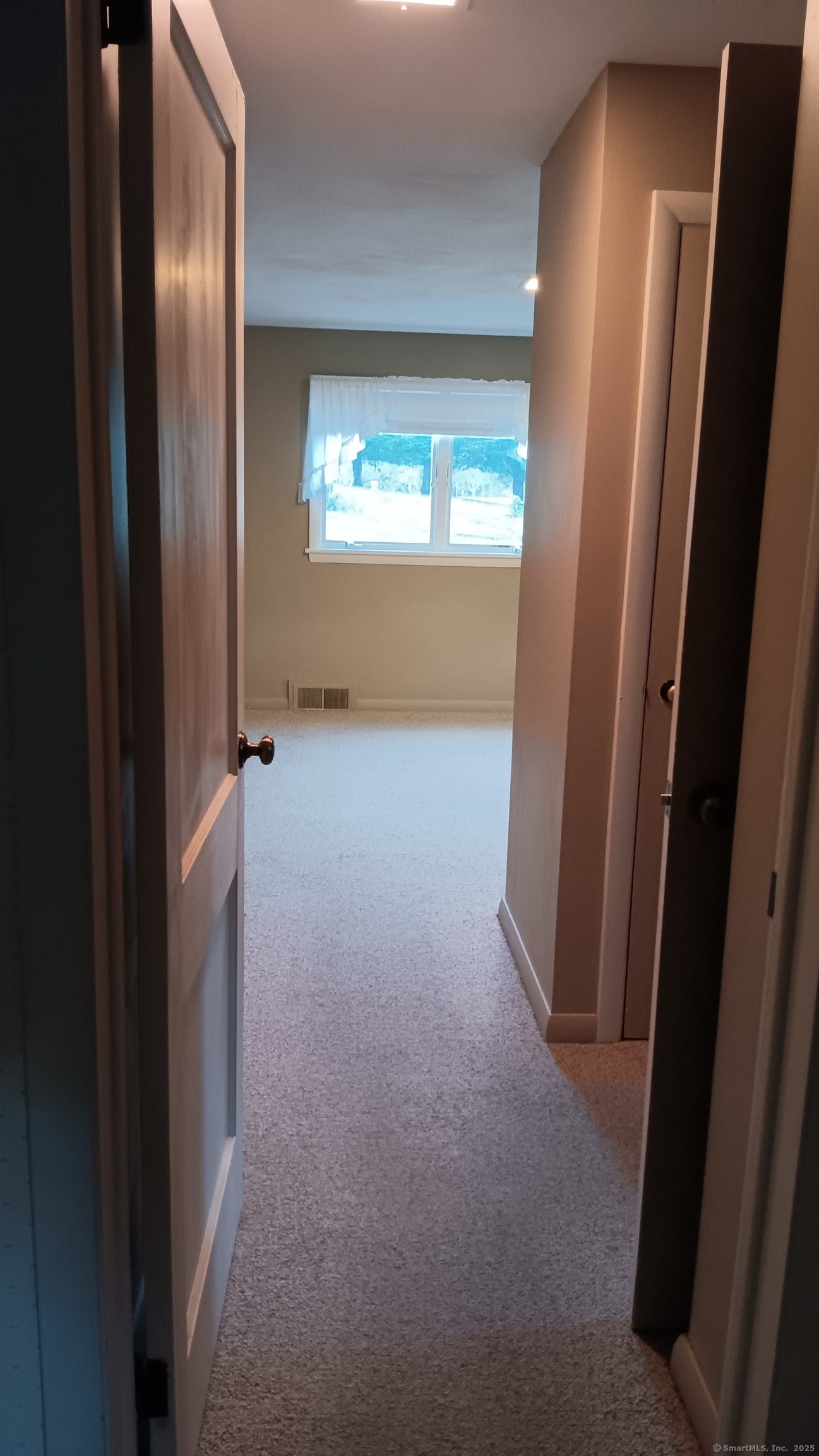 414 Canterbury Road Brooklyn, CT 06234 - Photo 21 of 40 Hallway in primary bedroom. Primary bathroom and closet leads into sleeping space and a lot of closet space & storage.