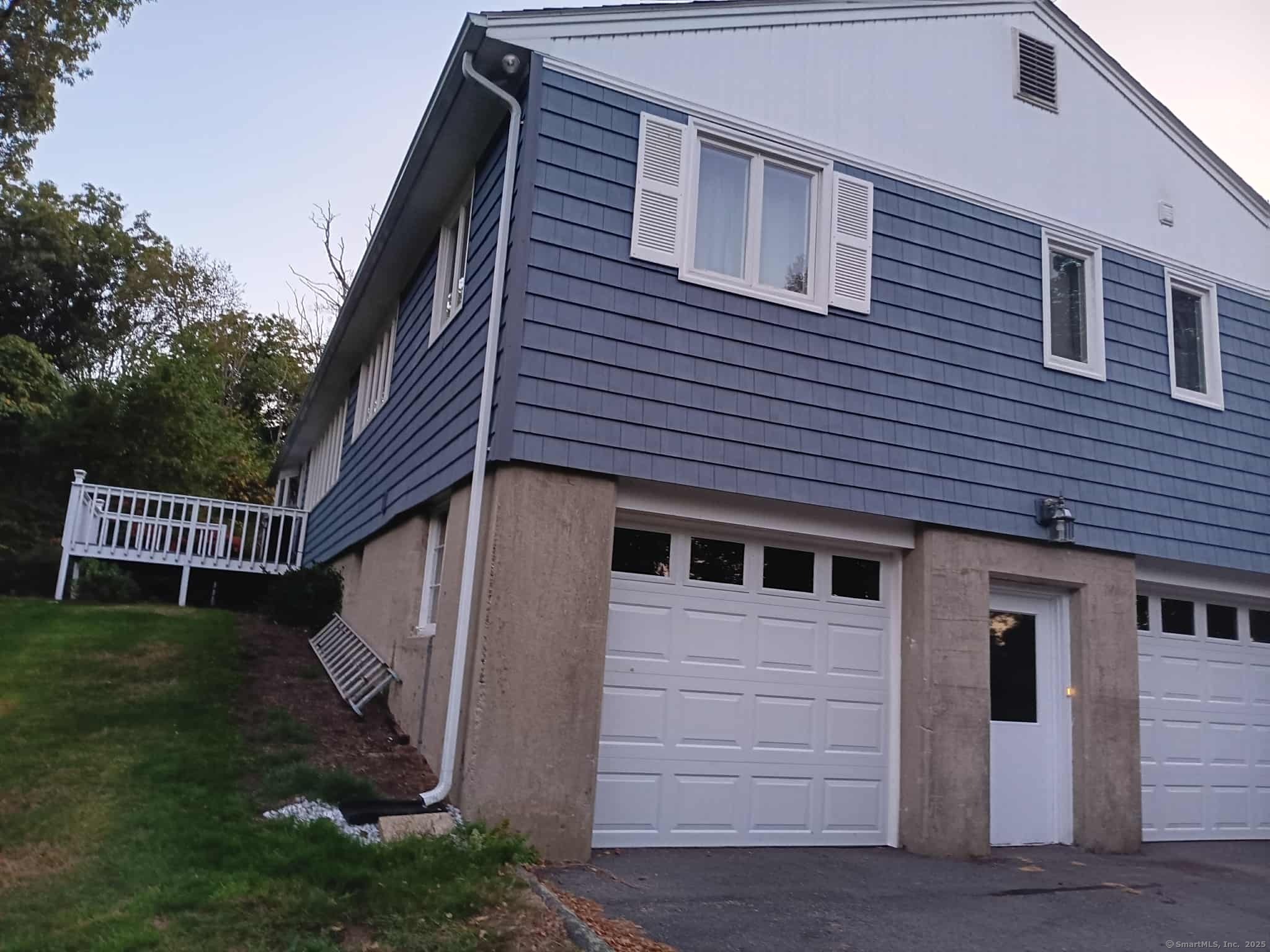 414 Canterbury Road Brooklyn, CT 06234 - Photo 29 of 40 New garage doors. Enjoy the babbling stream & brook from the back porch.