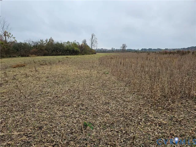a view of a lake with houses in the back