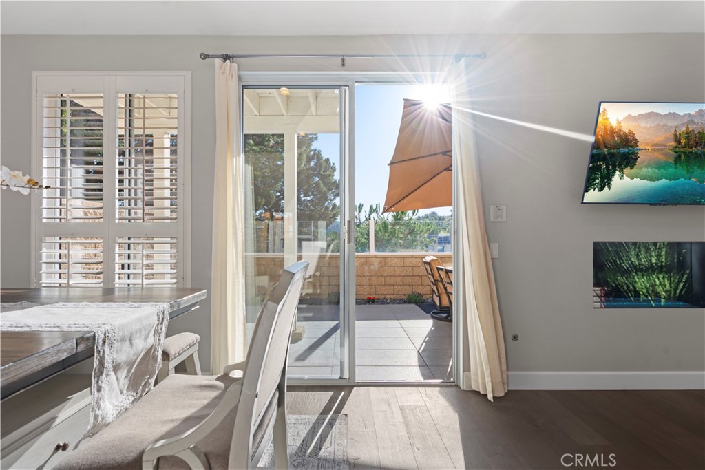 33 Gauguin Circle Aliso Viejo, CA 92656 - Photo 15 of 49 a living room with furniture and a floor to ceiling window