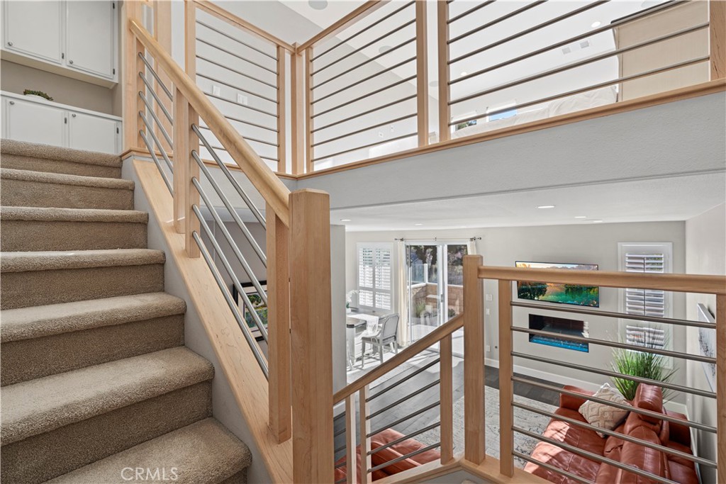 33 Gauguin Circle Aliso Viejo, CA 92656 - Photo 21 of 49 a view of staircase with lots of frames on wall
