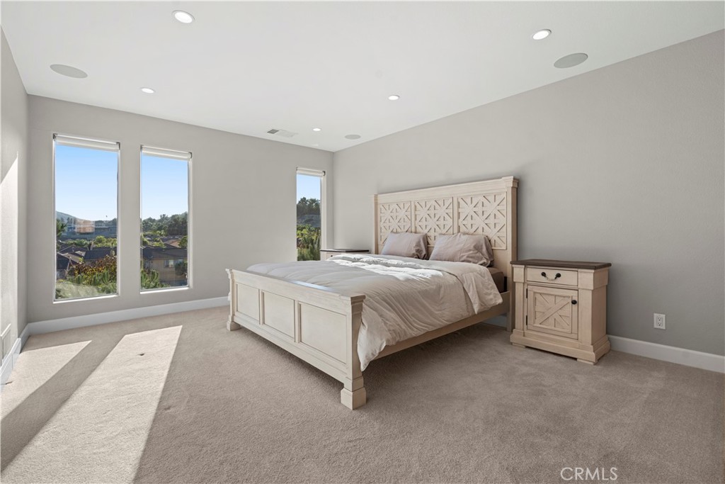 33 Gauguin Circle Aliso Viejo, CA 92656 - Photo 23 of 49 a large bed sitting in a room next to a window