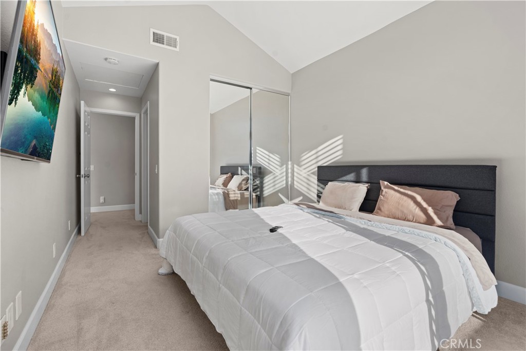 33 Gauguin Circle Aliso Viejo, CA 92656 - Photo 37 of 49 a bedroom with a bed and a mirror