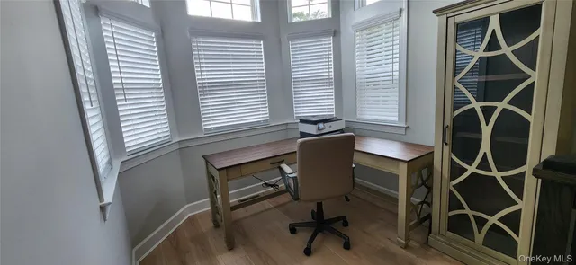 a view of entryway with wooden floor
