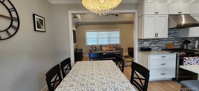 a kitchen with a refrigerator and a sink