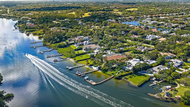 an aerial view of a house with a swimming pool